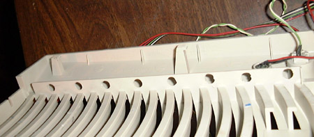 Drilled mounting holes in the case plastic